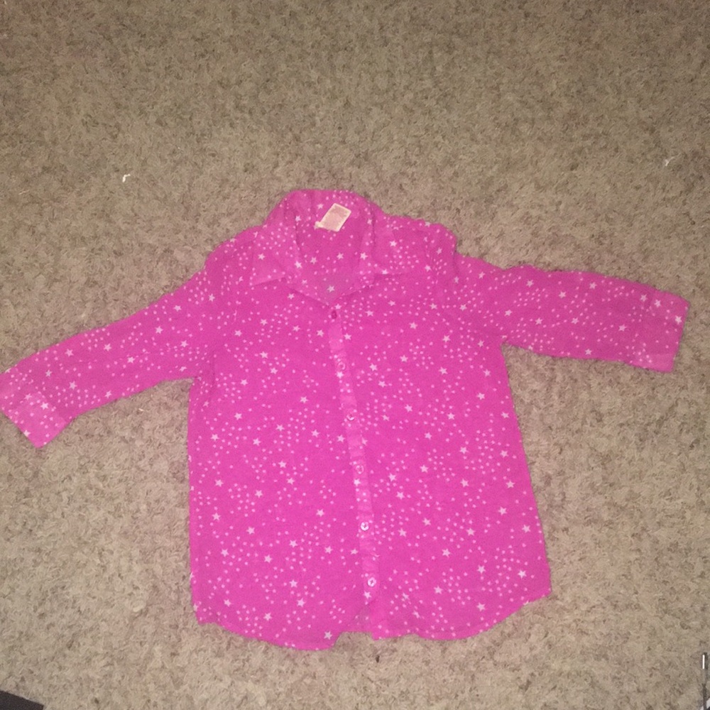 This is a button up shirt with cute little stars